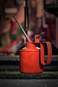 Close-up of red machine on table