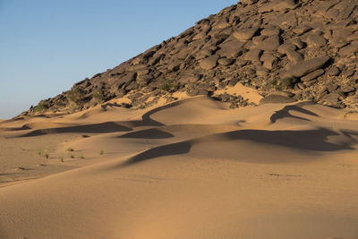 Scenic view of desert against clear sky