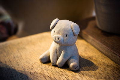 Close-up of pig figurine on table