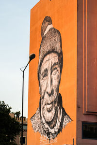 Low angle view of statue against building
