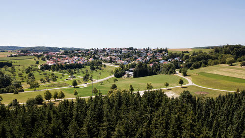 Panoramic shot of trees on field against clear sky