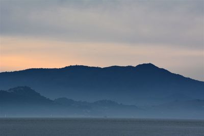 Scenic view of mountains against sky during sunset