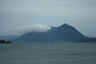 Scenic view of sea with mountains in background