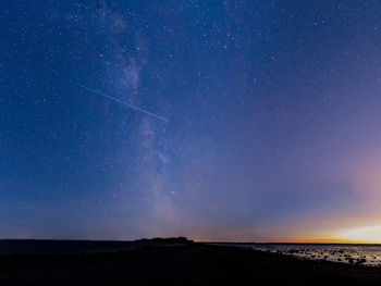 Scenic view of star field against sky at night