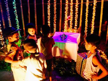 Children playing with multi colored lights