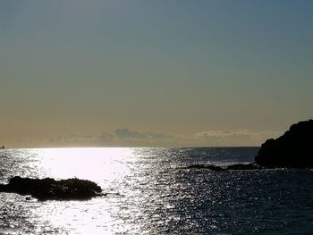 Scenic view of sea against clear sky during sunset