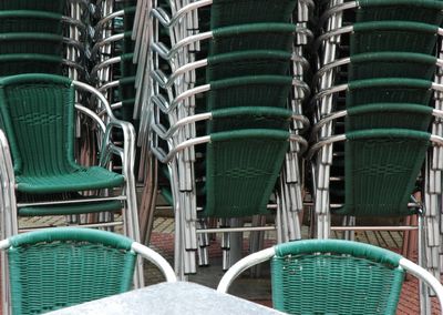 Green chairs arranged outdoors