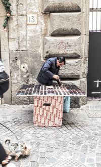 Man sitting on wall