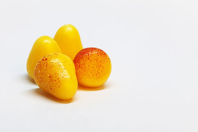 Close-up of oranges against white background