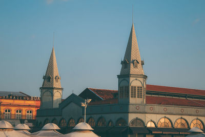 Low angle view of buildings against clear sky