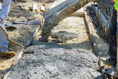 Low section of men working at construction site