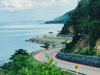 High angle view of road by sea against sky