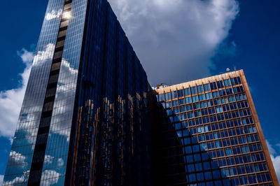 Low angle view of modern buildings against sky