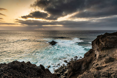 Scenic view of sea against sky during sunset