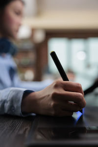 Woman hands using digitized pen