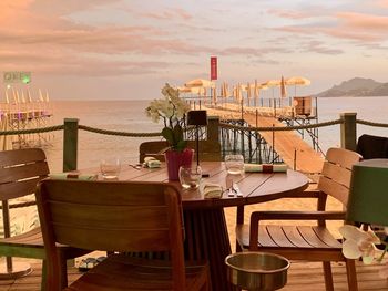 Empty chairs and tables in restaurant