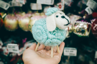 Close-up of hand holding stuffed toy