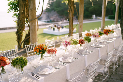 View of decorated place sitting during wedding ceremony