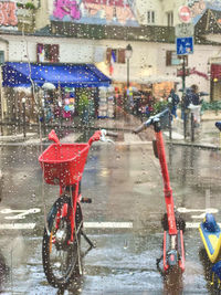 Bicycles on wet street during rainy season