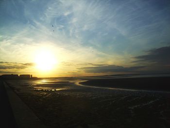 Scenic view of sea at sunset