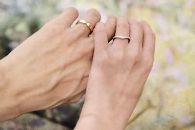 Close-up of couple holding hands