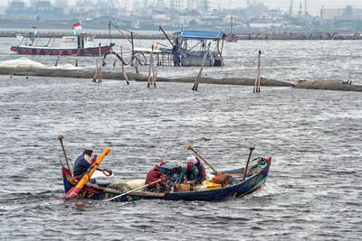 View of boating in calm lake