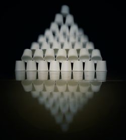 Close-up of chess pieces against black background