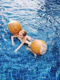 High angle view of girl swimming in pool