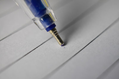 Close-up of pen on white paper