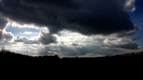 Scenic view of silhouette landscape against sky