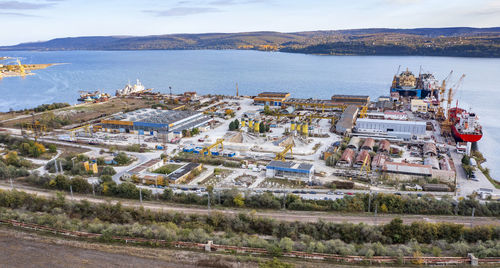 High angle view of townscape by sea