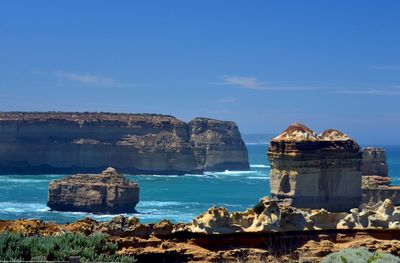 Built structure by sea against sky