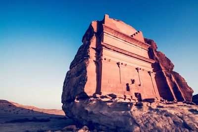 Low angle view of old ruins against blue sky