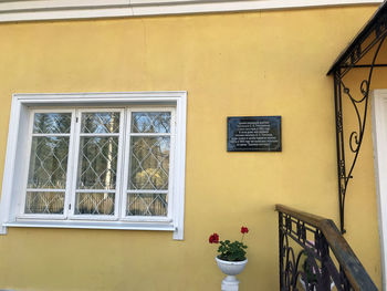 Potted plant on window sill of building