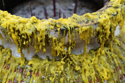 Selective focus to solid grey wax droplet closeup. colorful melted candle drips in shape 