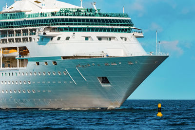 Ship sailing in sea against sky