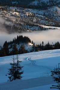 Scenic view of snow covered landscape against sky