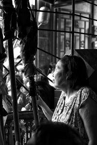 Portrait of woman sitting outdoors