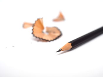 High angle view of pencils on white background