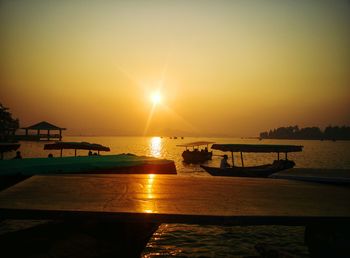 Scenic view of sea against clear sky during sunset