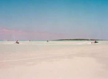 Scenic view of beach against clear sky