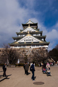 People in front of historical building
