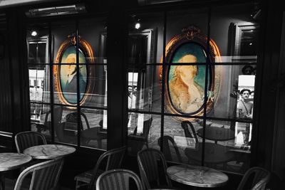 Chairs and tables in glass window