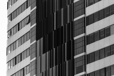 The facade of a modern multi-storey building black and white photo