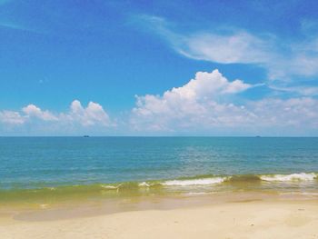 Scenic view of sea against blue sky