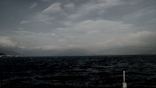 Scenic view of sea against cloudy sky