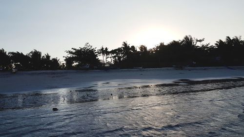 Scenic view of beach against clear sky