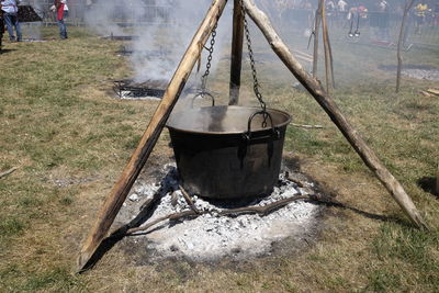 Smoke emitting from container at campfire