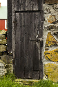 Closed wooden door of old building