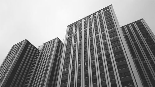 Low angle view of modern buildings against sky